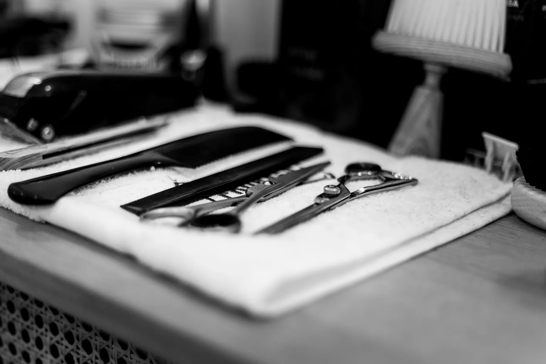 Scissors and combs on a white towel